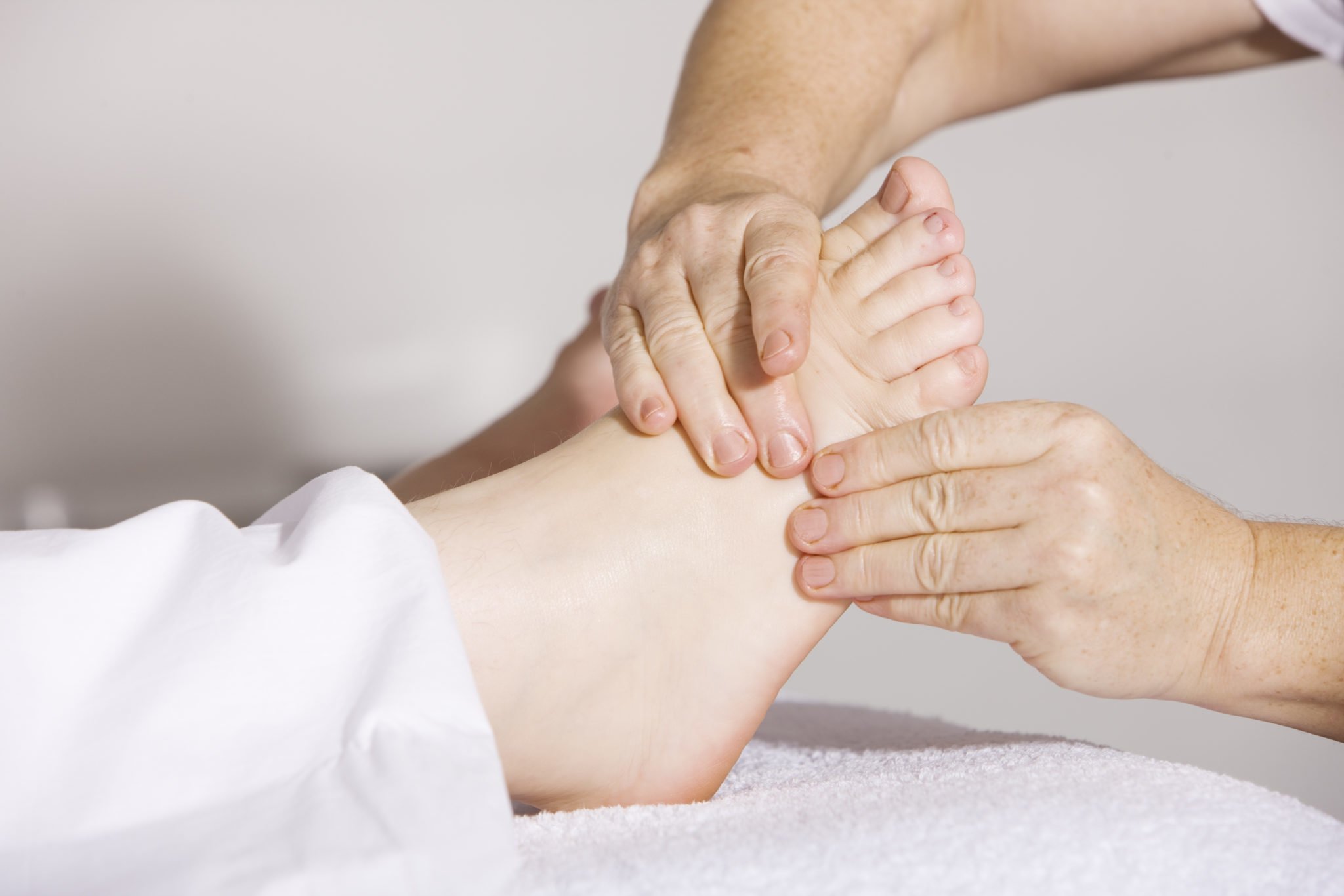 Canva - Person Massaging Foot